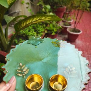 Handcrafted 8-inch aqua green resin Rakhi thali with top flower motif and bottom golden katoris