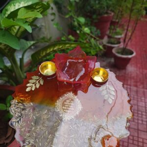 Handcrafted 8-inch deep red resin pooja thali with Gayatri Mantra inscription, 3D lotus diya holder, embedded rice grains, and golden katoris