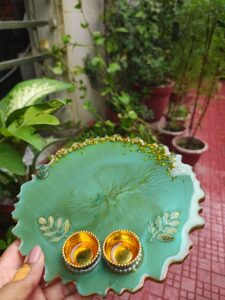 Handcrafted 8-inch emerald green resin Rakhi thali with top gold flakes and bottom golden katoris