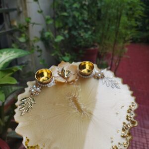 Handcrafted 8-inch cream gold resin Rakhi thali with Ganesha idol flower motif and golden katoris