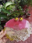 Handcrafted 8-inch coral pink and clear resin Rakhi thali with Vakratunda Mahakaya mantra and embedded rice grains