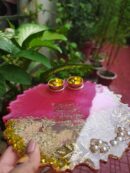 Handcrafted 8-inch deep pink resin pooja thali with Ganesh Mantra shloka, embedded rice grains, and golden katoris