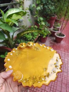 Handcrafted 8-inch yellow resin Rakhi thali with pearl accents and golden katoris